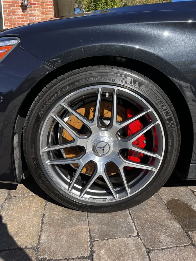 Detailed alloy wheel and red brake caliper