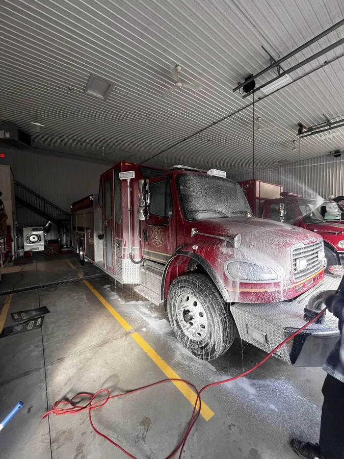 Truck covered in snow foam during a hand wash