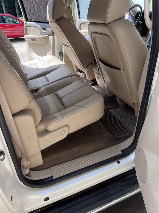Cleaned SUV interior with light leather seats